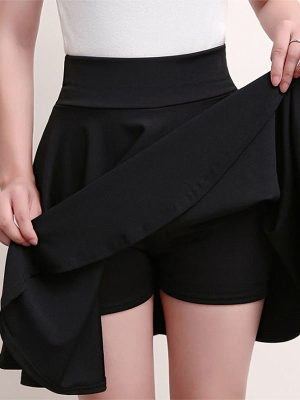Black pleated A-line skirt with attached shorts and elastic waistband