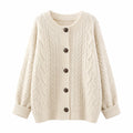 Beige cable knit cardigan with crew neckline, button front, and ribbed cuffs