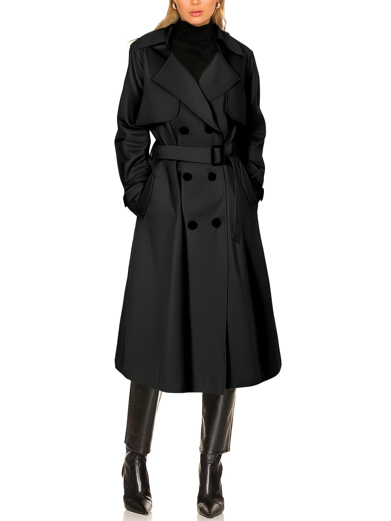 Black longline double-breasted trench coat on model, belted waist and double-button front