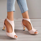 Blush peep-toe block heel sandals with open toe and back zip closure