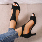Black peep-toe block heel sandals with open heel and back zip closure