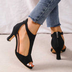 Black peep-toe block heel sandals with open toe and visible back zipper