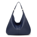 Navy blue textured leather hobo bag with two top handles and open curved front.