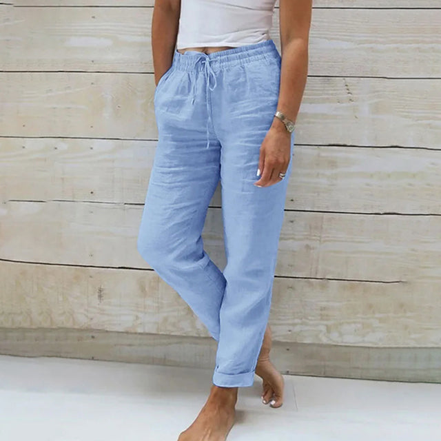 Light blue wide-leg drawstring trousers with relaxed fit and cuffed hems