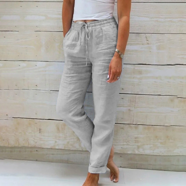 Gray wide-leg drawstring trousers with relaxed fit and cuffed hems