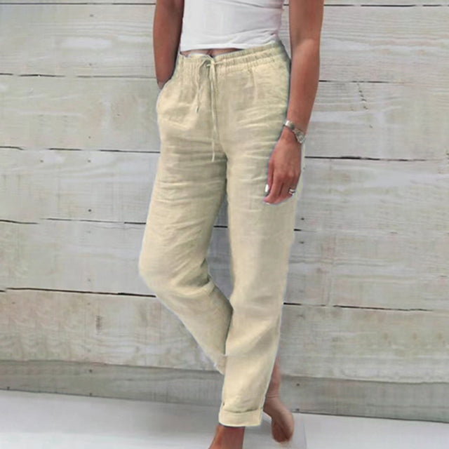 Beige wide-leg drawstring trousers with relaxed fit and cuffed hems