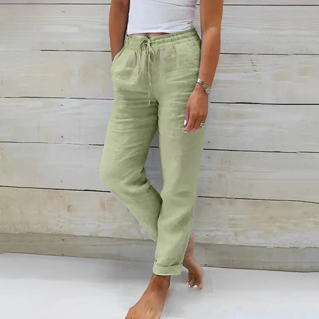 Olive green wide-leg drawstring trousers with relaxed fit and cuffed hems