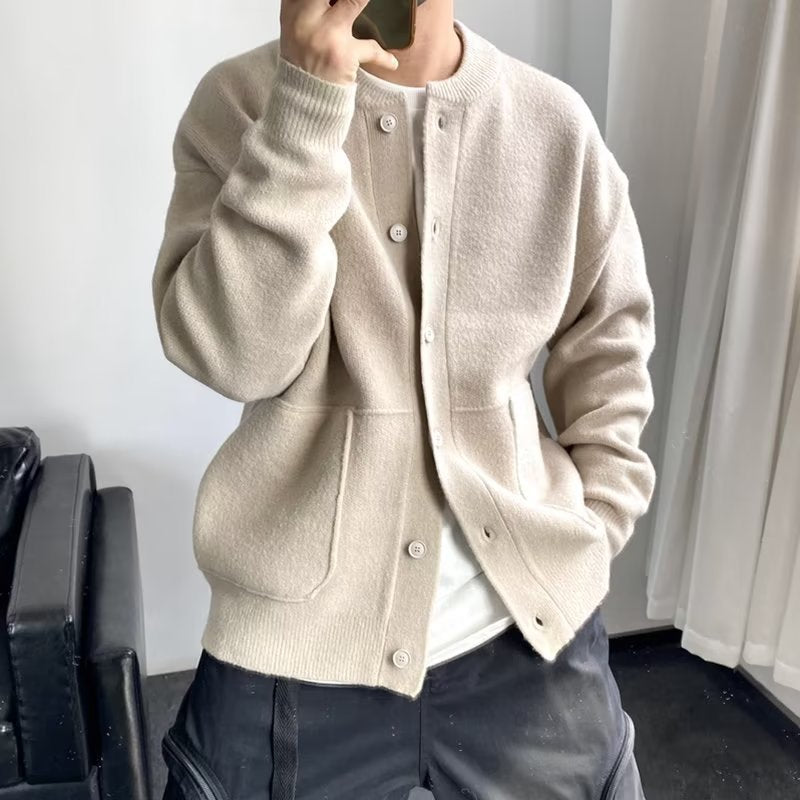 Beige button-front luxury sweater with stand collar and side pockets