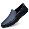 Men’s blue leather slip-on loafer with moc toe stitching and dark rubber sole