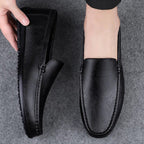 Men’s black leather slip-on loafer with moc toe stitching and padded collar