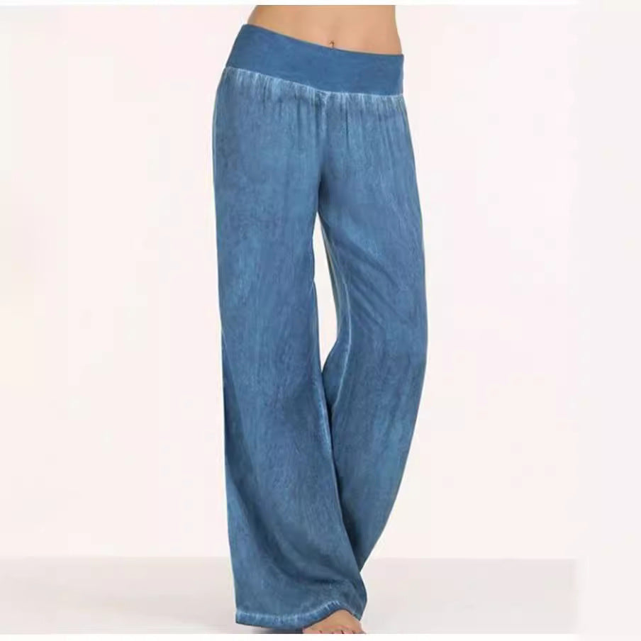 Dark blue relaxed wide-leg trousers drape loosely from elastic waistband to wide hem