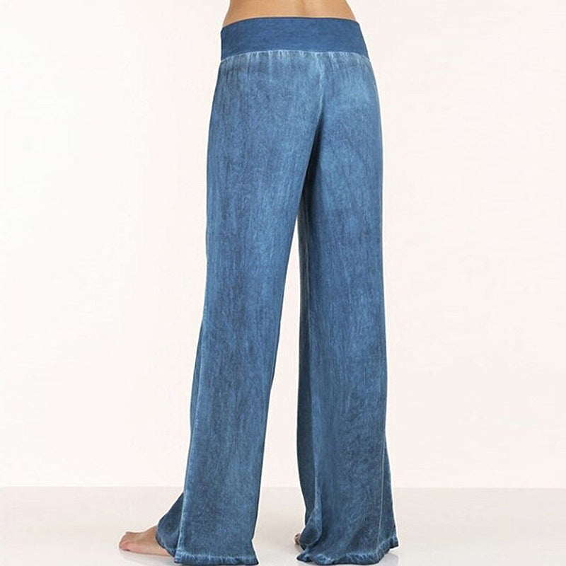 Dark blue relaxed wide-leg trousers viewed from behind, full length wide flare
