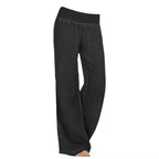 Black relaxed wide-leg trousers with elastic waistband and full-length loose legs