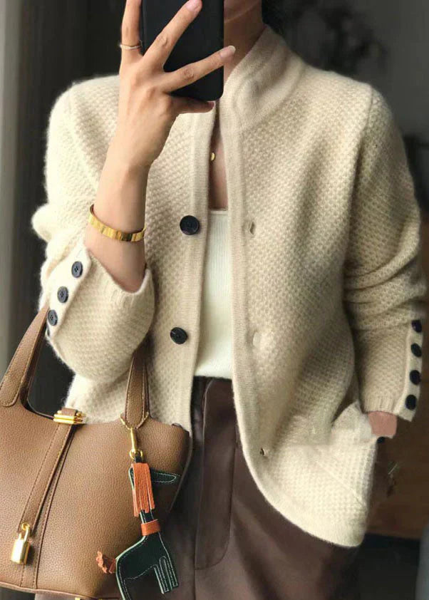 Off-white knit button-front cardigan with ribbed cuffs and V-neck
