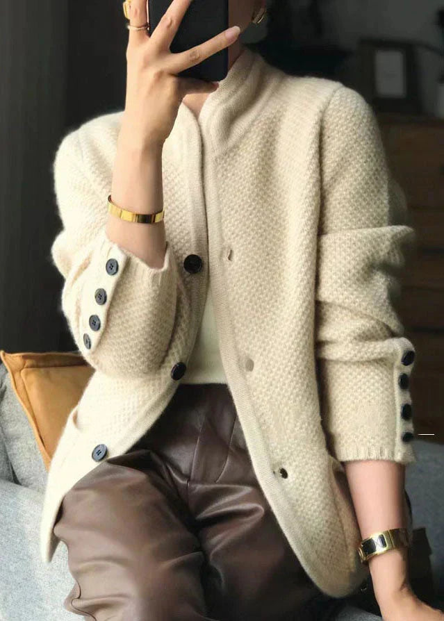 Off-white knit button cardigan with stand collar and relaxed sleeves