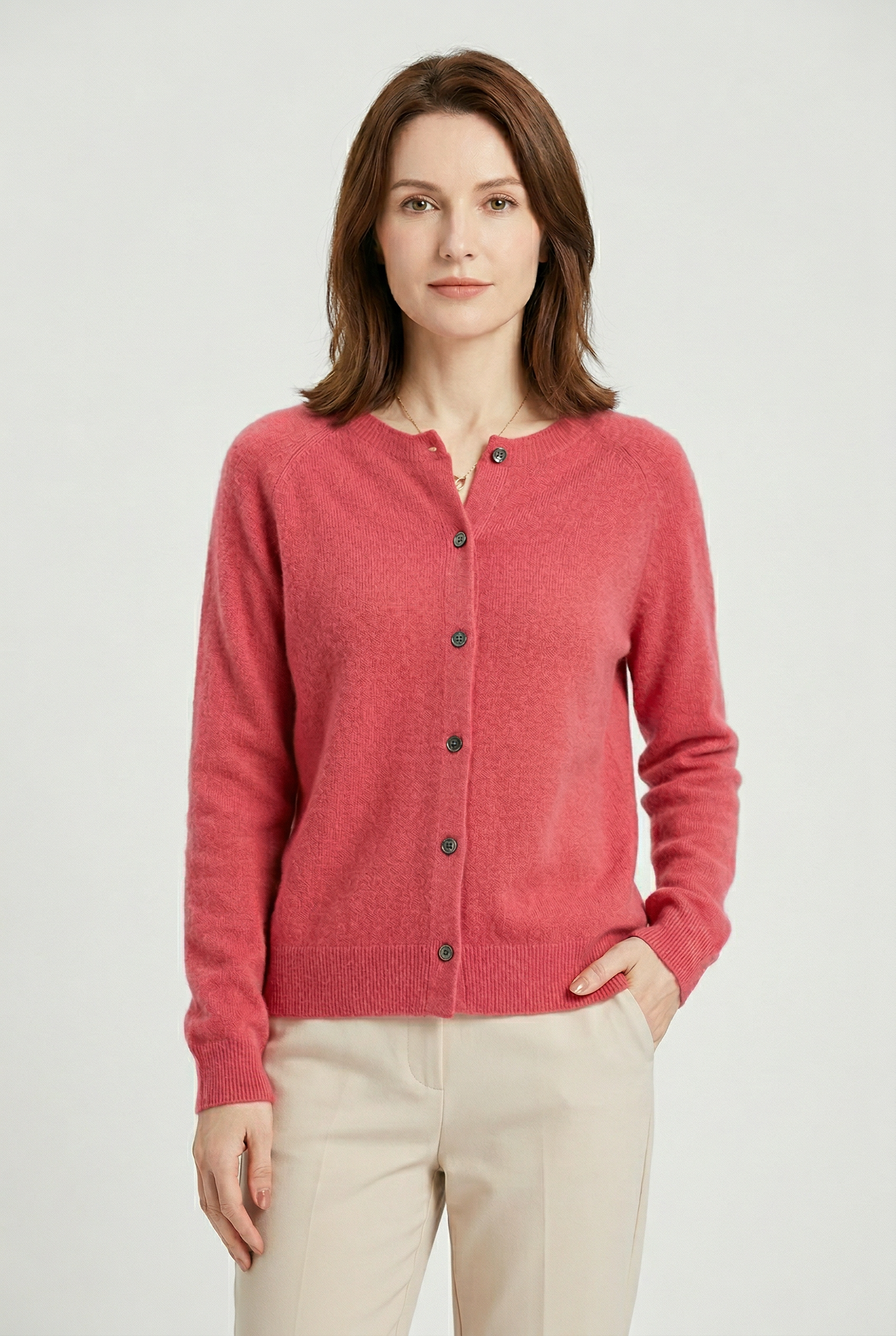 Women’s pink V-neck button cardigan with long sleeves and dark button front