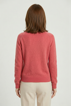 Women’s pink V-neck button cardigan from the back with long sleeves