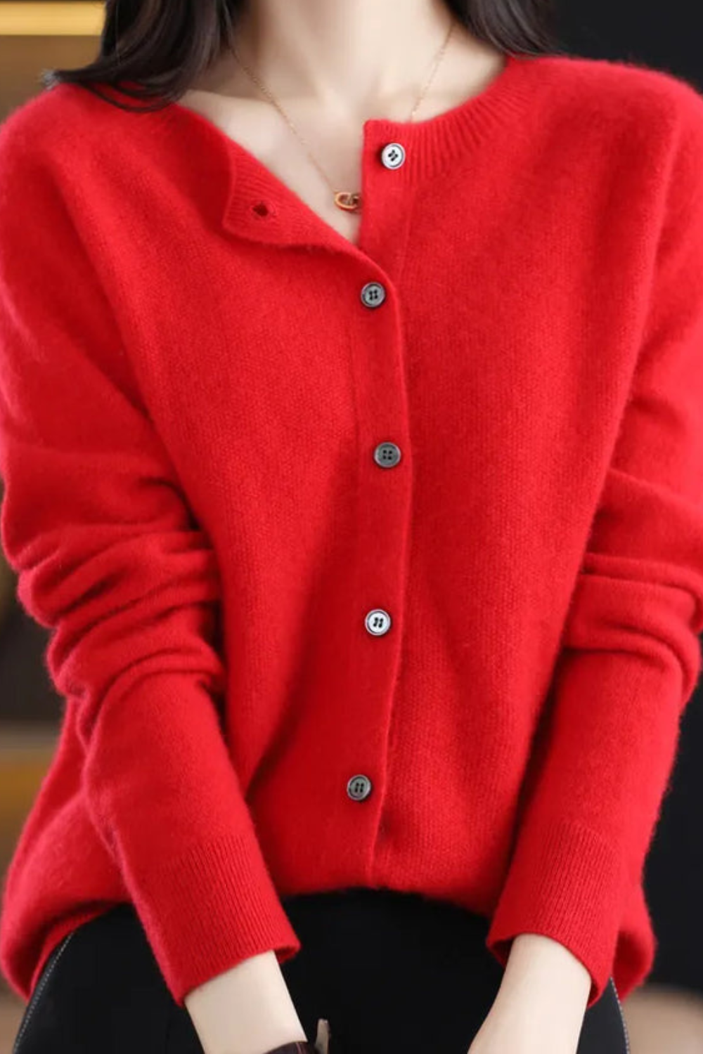 Women’s V-neck button cardigan in vivid red, long sleeves, front button closure.