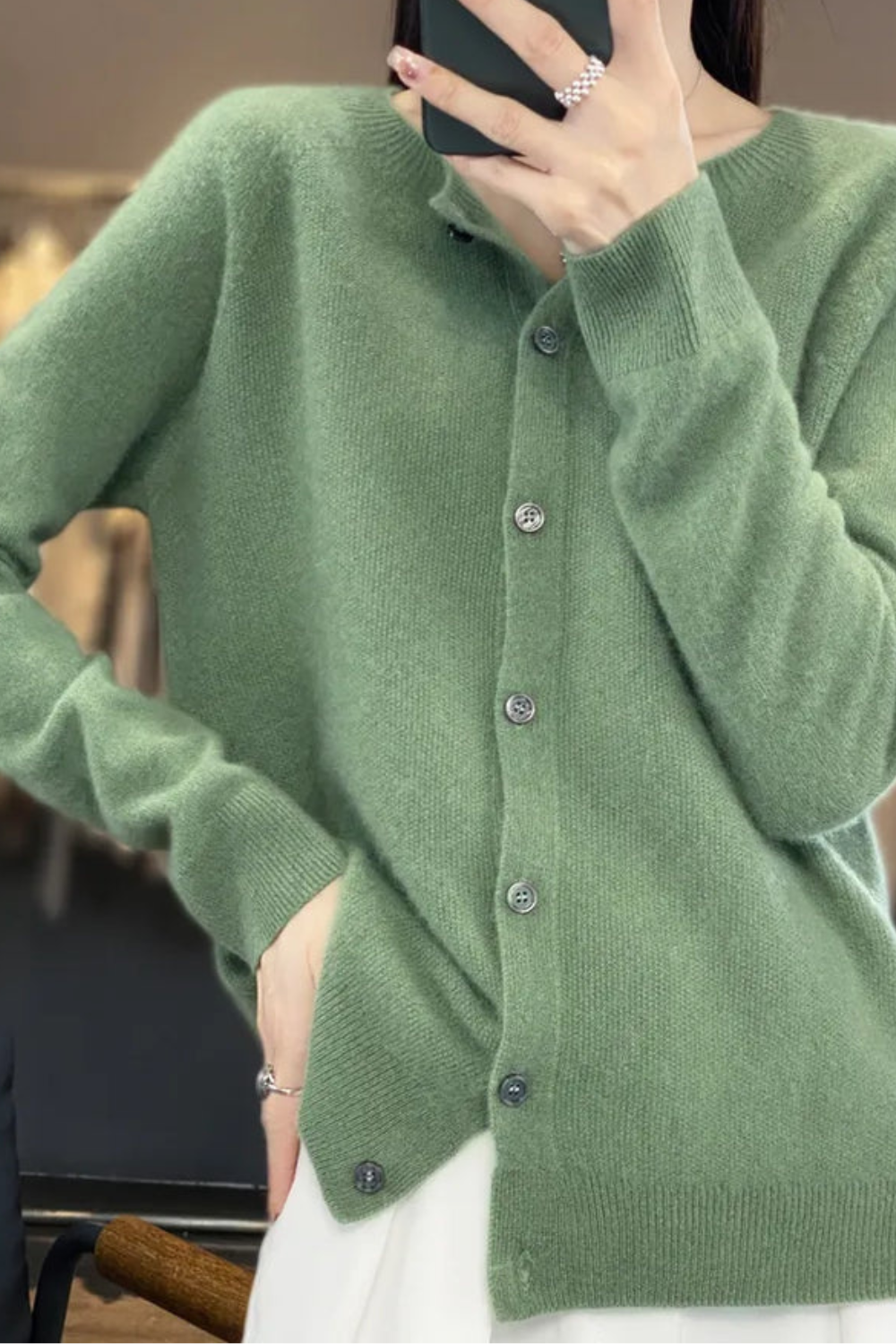 Women’s V-neck button cardigan in sage green, long sleeves, button-front placket.