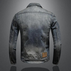 Andreas™ classic denim jacket, medium wash back view with tan leather patch and cuff seams