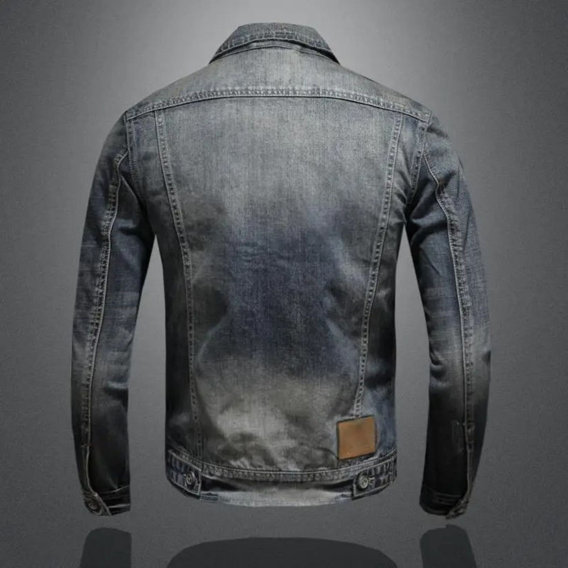 Andreas™ classic denim jacket, medium wash back view with tan leather patch and cuff seams