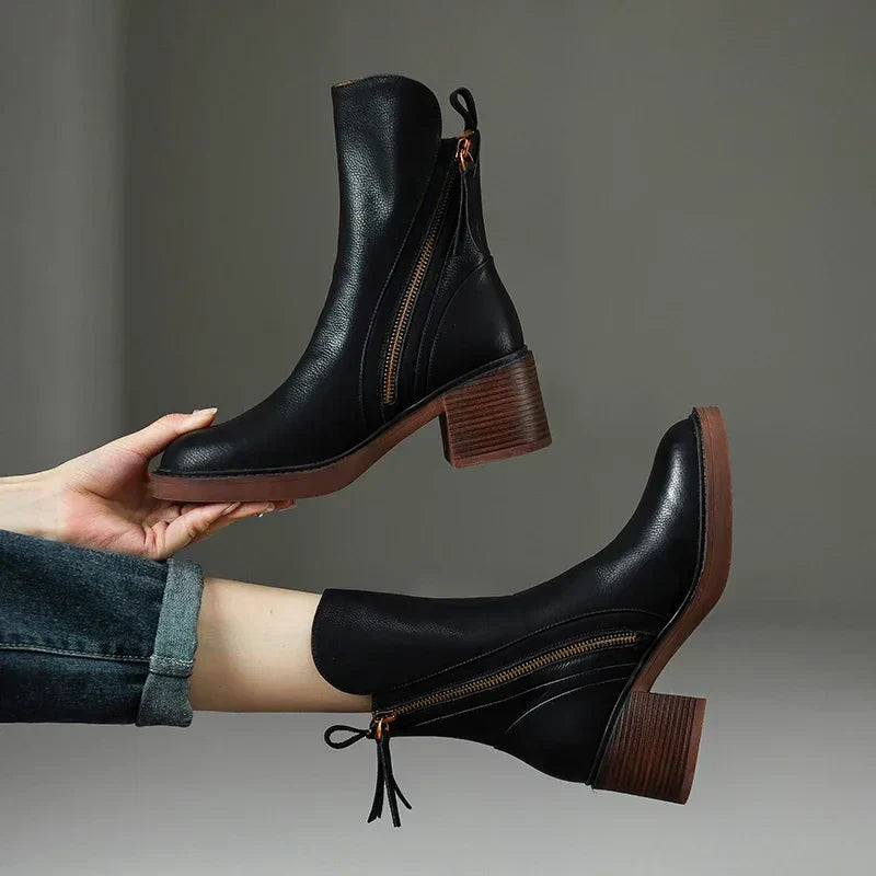 Black ankle boots with side zipper and block heel, leather-look finish