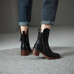 Black ankle boots with side zipper and block heel, shown from back and side