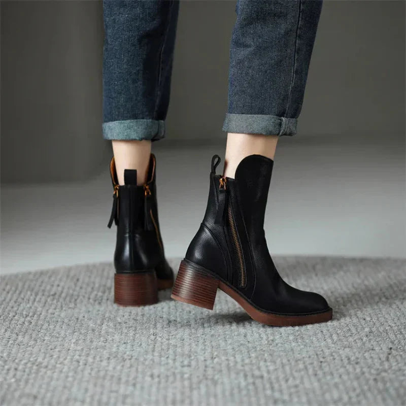 Black ankle boots with side zipper and block heel, shown from back and side