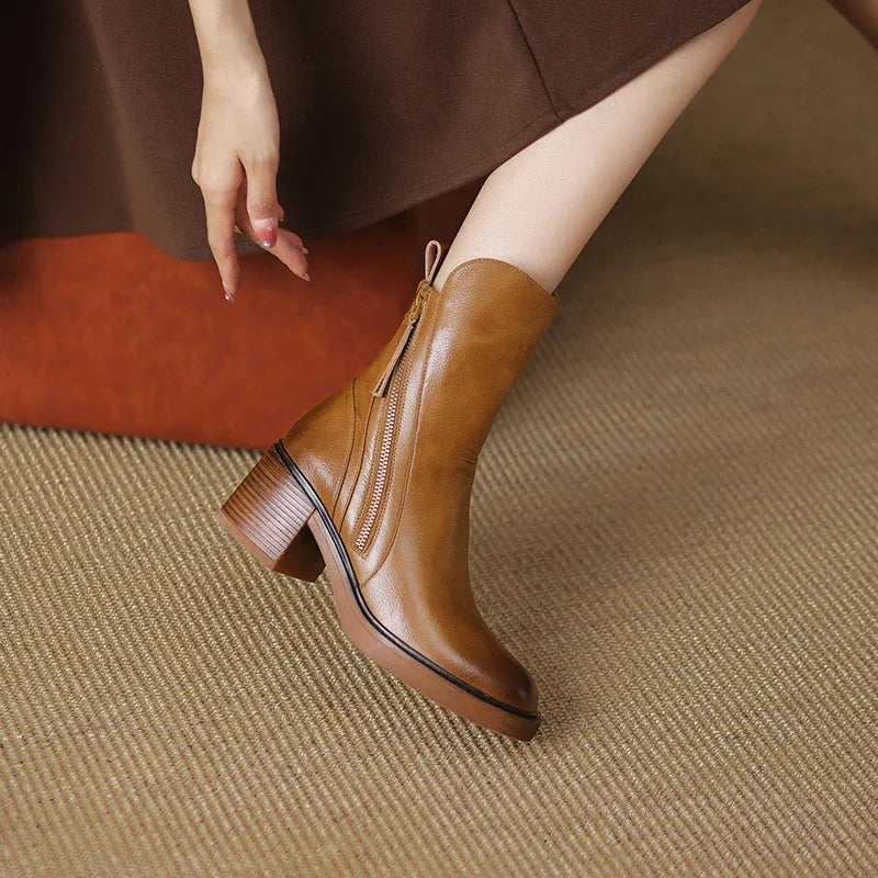 Brown ankle boots with side zipper and block heel, tassel pull details