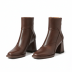 Brown ankle boots with block heels, side seam panels, and cuff opening