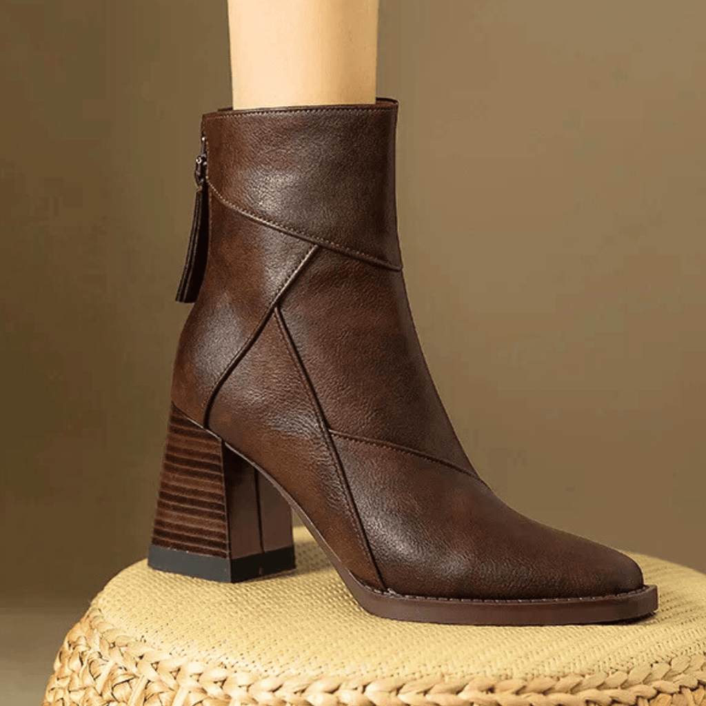 Brown ankle boots with block heel, tassel side pull, and crisscross stitching