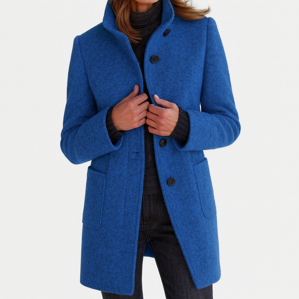 Blue winter coat with high collar, button front, and flap pockets at the sides