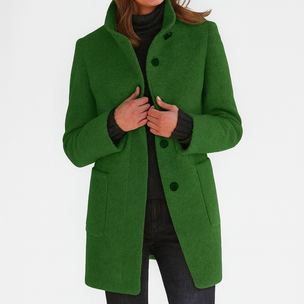 Green winter coat with high collar, button front, and flap pockets on the sides