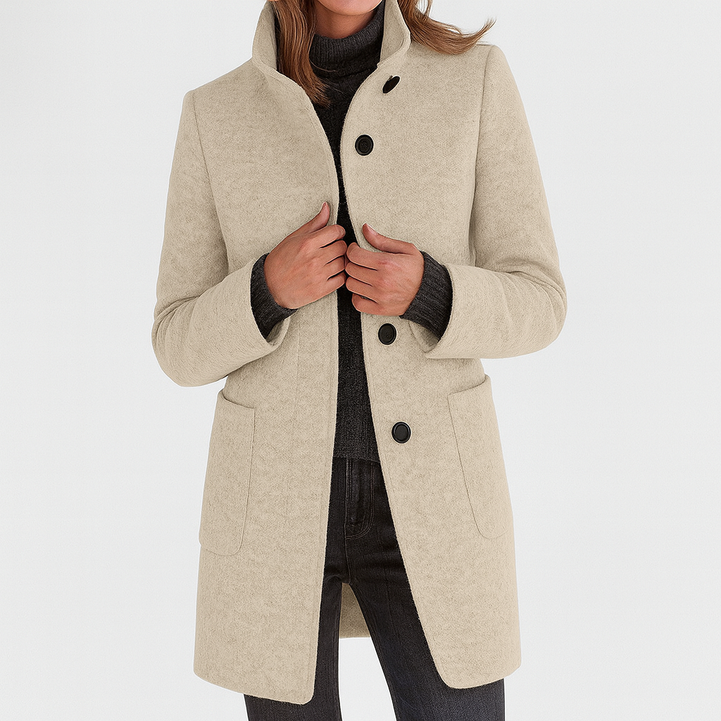Beige winter coat with high collar, button front, and flap pockets on the sides