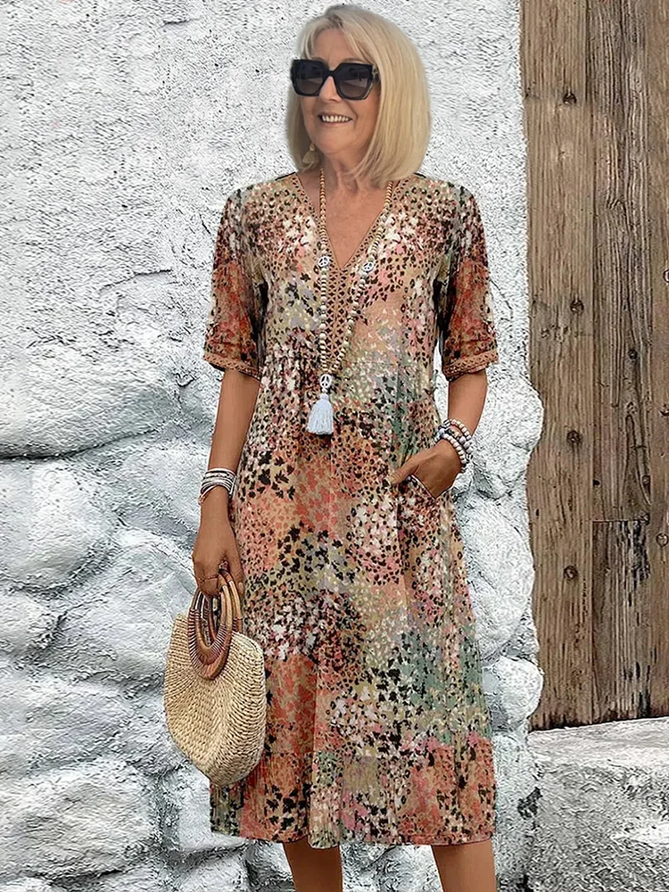 Women's floral V-neck midi dress in beige and brown tones, short sleeves, tassel tie