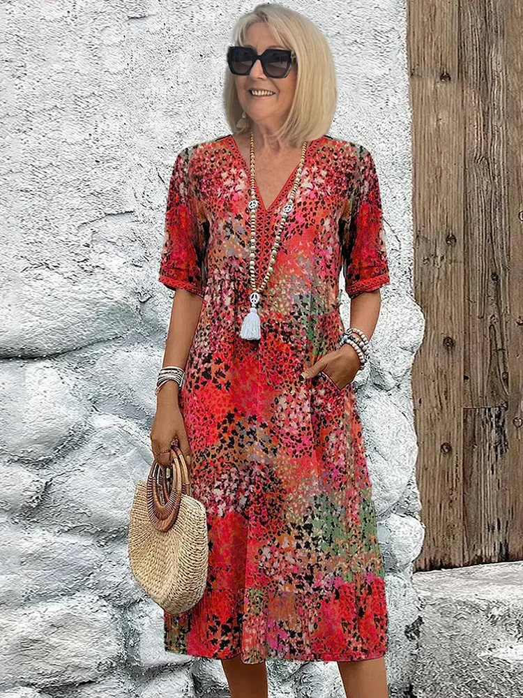 Women's floral V-neck midi dress in magenta red, short sleeves, tassel tie detail