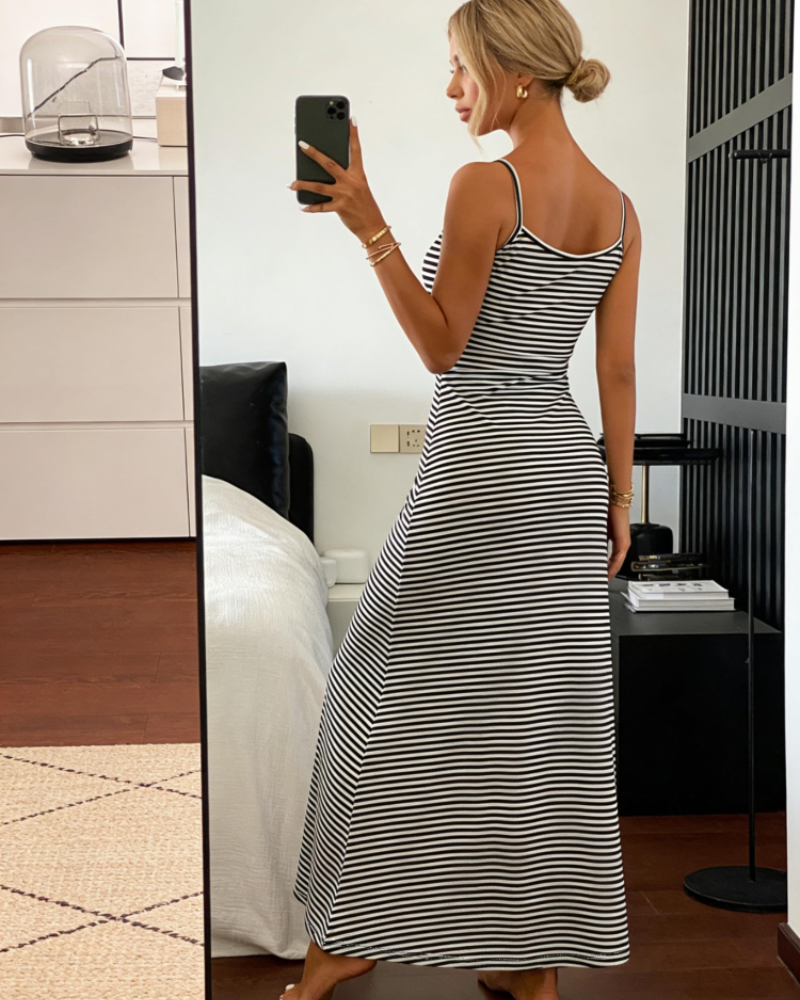 Black-and-white striped fitted midi dress with thin straps (back view).