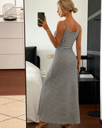 Black-and-white striped fitted midi dress with thin straps (back view).