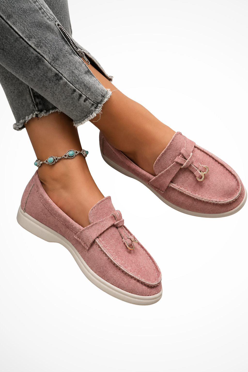 Pink suede slip-on loafers with front strap and gold bit detail