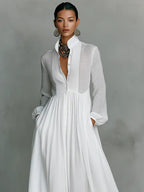 White women's maxi dress with stand collar, button front and long sleeves