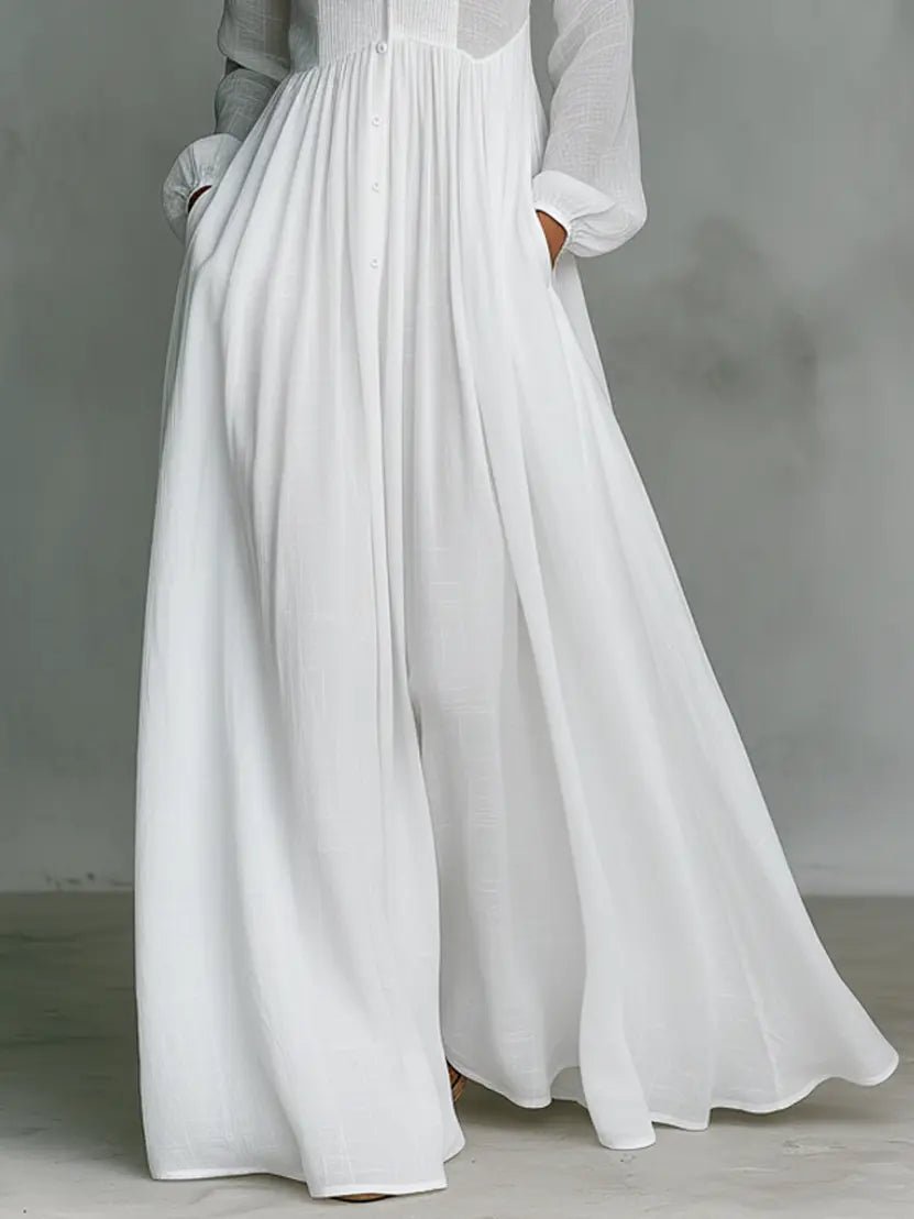 White women's maxi dress with gathered waist and flowing A-line skirt