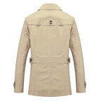 Beige trench coat back view with yoke seam and storm flap detail at waist.
