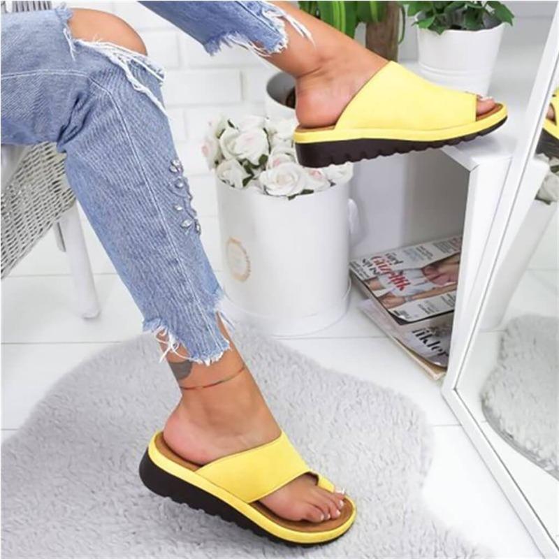 Women's yellow backless platform slide sandals with asymmetrical cutout straps