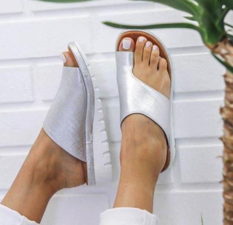 Women's silver backless platform slide sandals with asymmetrical cutout straps