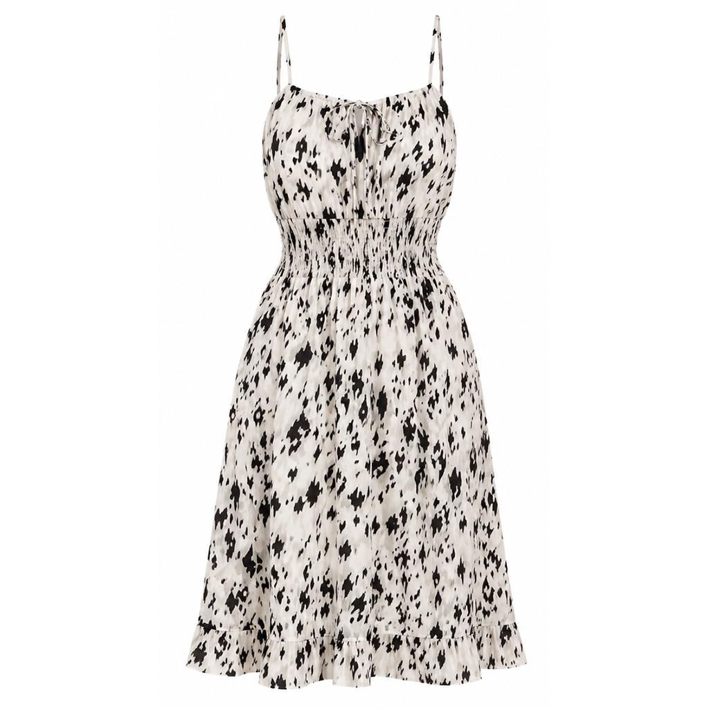 White sleeveless knee-length dress with black abstract print and thin spaghetti straps