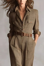 Women's brown check jumpsuit close-up, collared button front, chest pocket, belt