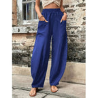 Relaxed wide-leg palazzo trousers in dark blue with elastic waist and billowy silhouette
