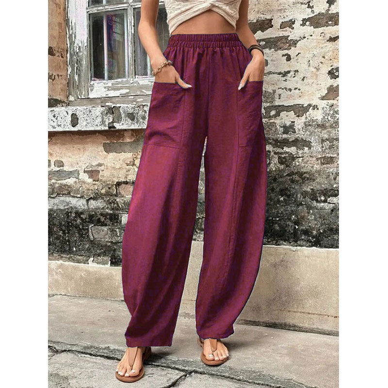 Relaxed wide-leg palazzo trousers in dark red with elastic waist and wide, relaxed fit