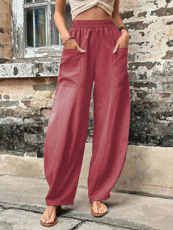 Relaxed wide-leg palazzo trousers in dusty rose with elastic waist and wide, relaxed legs