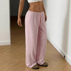 Pink wide-leg sweatpants with elastic waistband and drawstring, relaxed drape
